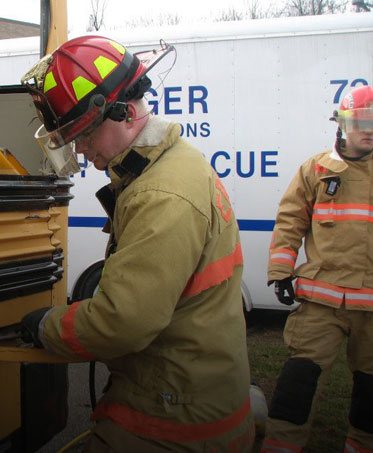 A firefighter working in front of a Boone County rescue unit