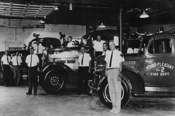 Members of the department in the station bay beside a pumper lettered Point Pleasant Vol. Fire Dept. No. 2